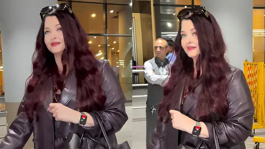 Aishwarya Rai Returns From Paris In Plum Coat, Airport Chic